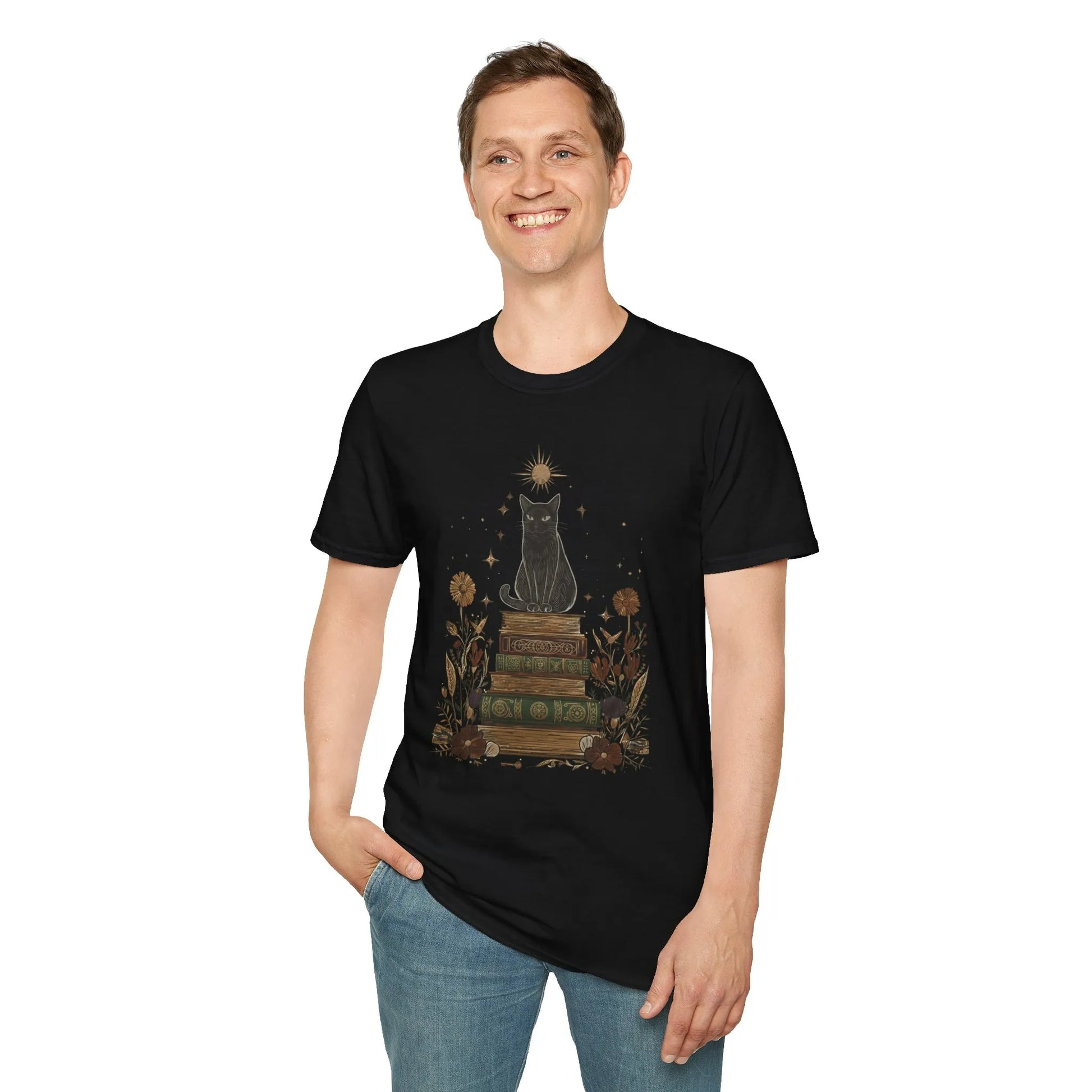A smiling man wearing the Mystic Cat & Books T-Shirt featuring a magical black cat on vintage books, perfect for book lovers.