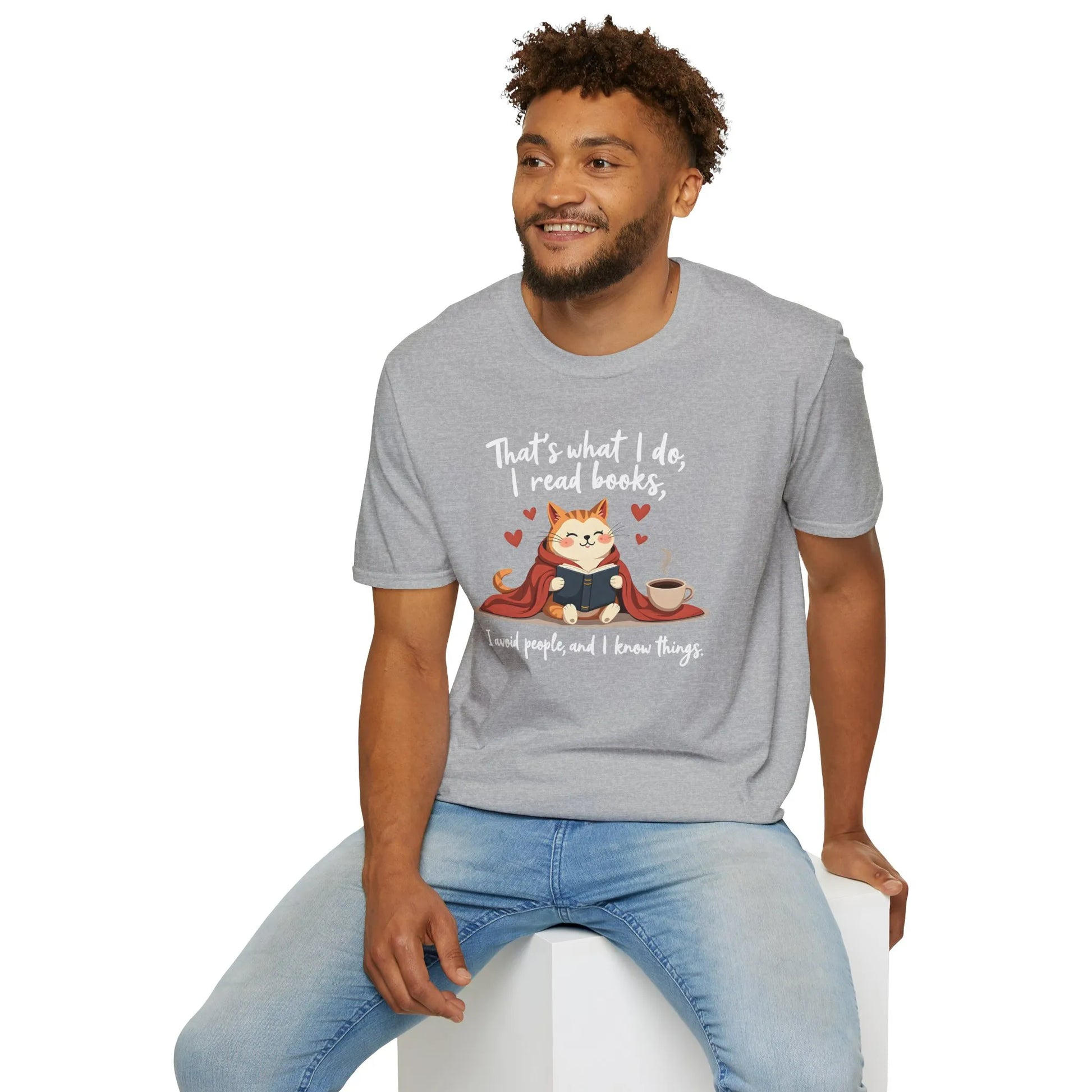 A cozy gray tee featuring a cat reading books with a coffee cup, text: "That's what I do, I read books, & know things" - perfect gift for book lovers.