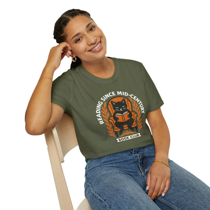 Woman wearing a cozy olive t-shirt featuring a cat reading, with text 'Reading Since Mid-Century, Book Club'. Perfect gift for book lovers!