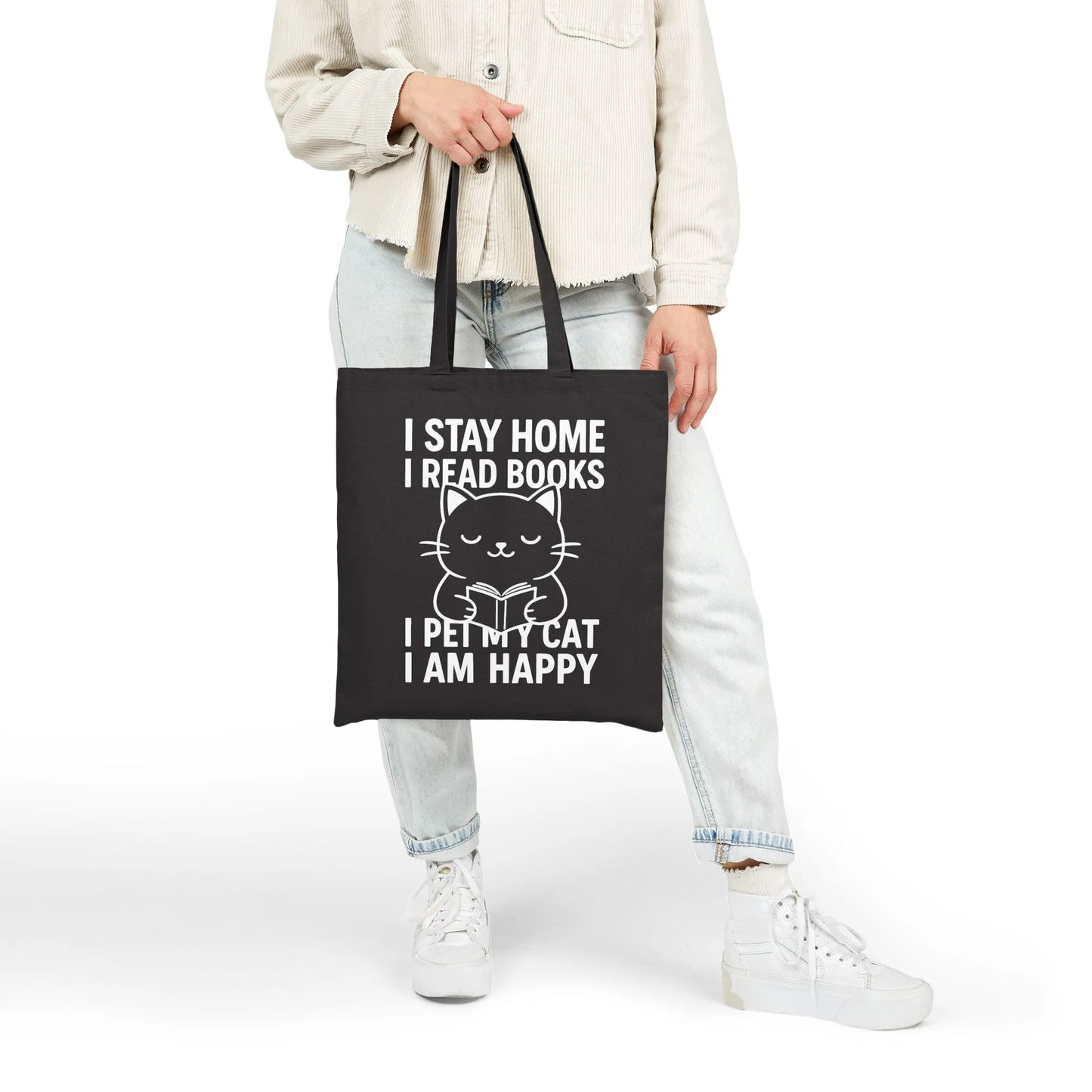 Happy Cat Reader Tote Bag with a cute cat illustration and text: 'I STAY HOME I READ BOOKS I PET MY CAT I AM HAPPY.' Perfect for book lovers!