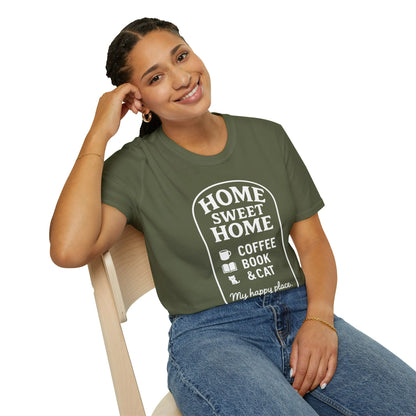 Smiling individual in a cozy 'Home Sweet Home' tee featuring coffee, book, and cat designs, perfect for book lovers.