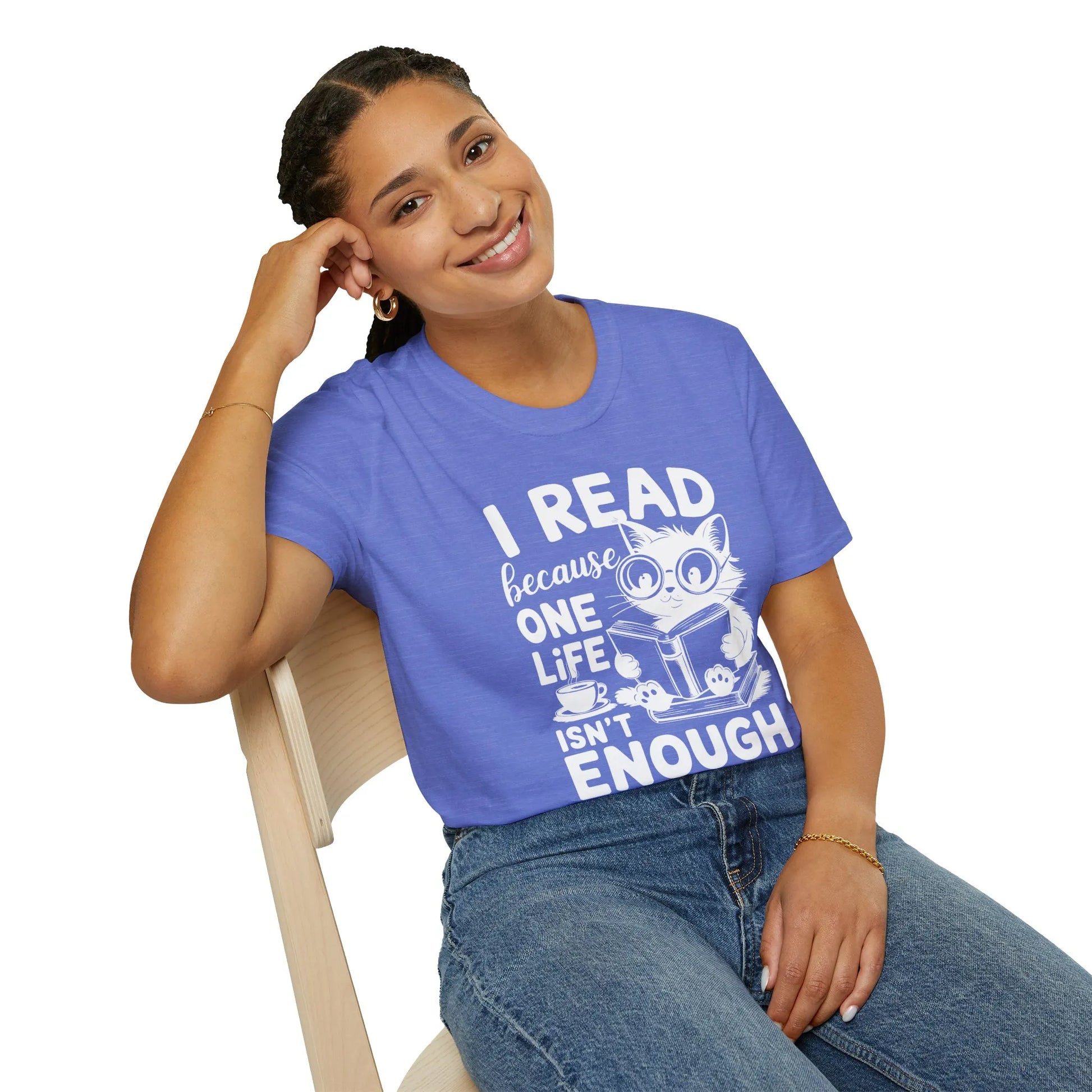 Cozy blue t-shirt featuring a cute cat and the text 'I READ because ONE LIFE isn’t ENOUGH,' perfect for book lovers.