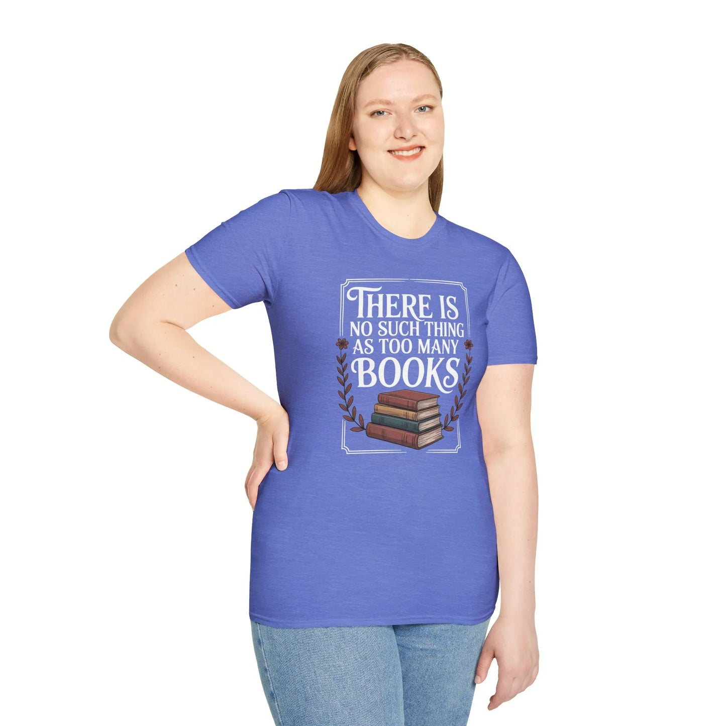 A woman in a cozy reading nook wears a relaxed fit Too Many? Never. T-Shirt surrounded by books and a cat, celebrating the joy of literature.