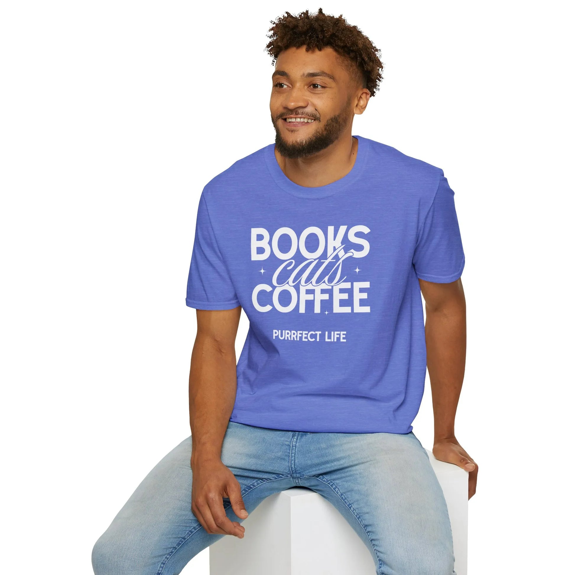 A man wearing a blue Trio of Joy T-Shirt with bold white text: 'BOOKS, cats, COFFEE, PURRFECT LIFE.' Perfect gift for book lovers.