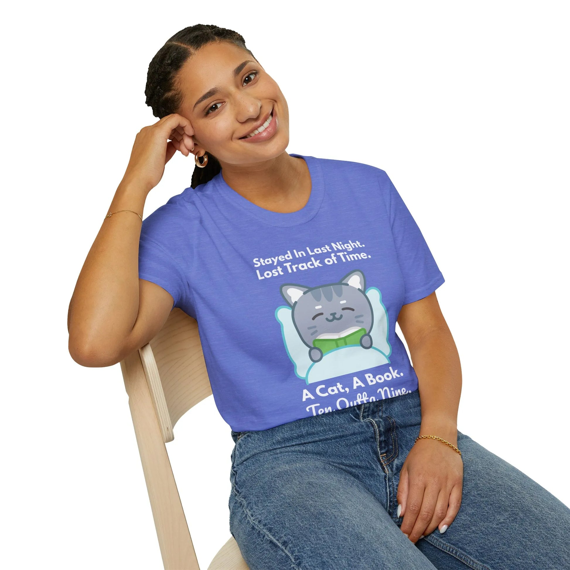 Cozy bookworm t-shirt featuring a cat under a blanket with text: 'Stayed In Last Night. A Cat, A Book. Ten Outta Nine.'