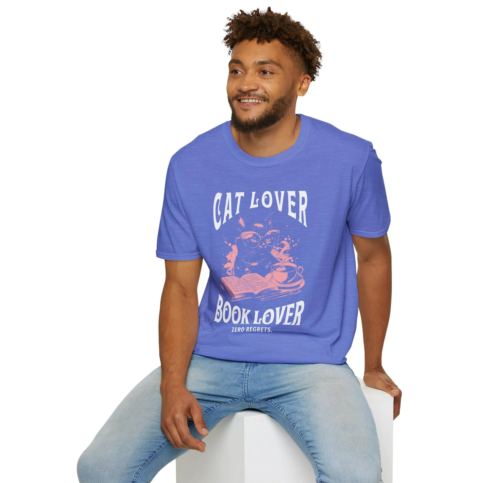 Man wearing a Cat & Book Lover T-Shirt featuring a playful cat and an open book, perfect for cozy reading days.