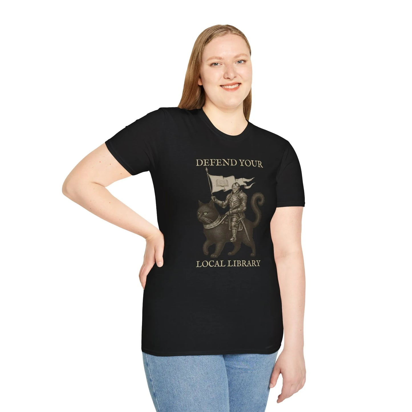 Library Defender T-Shirt featuring a knight on a cat with text 'DEFEND YOUR LOCAL LIBRARY,' perfect for book lovers.