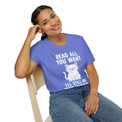 Woman wearing a cozy blue t-shirt with a playful cat illustration and the text 'Read All You Want, I'll Still Be Your Favorite', perfect for book lovers.