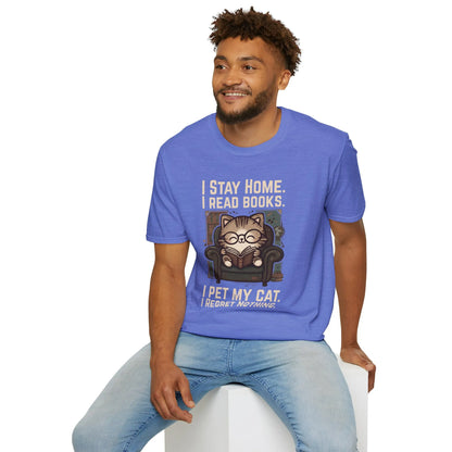 A man in blue Library Cat Reader T-Shirt, featuring a cute cat in glasses on a cozy chair with bookish humor.