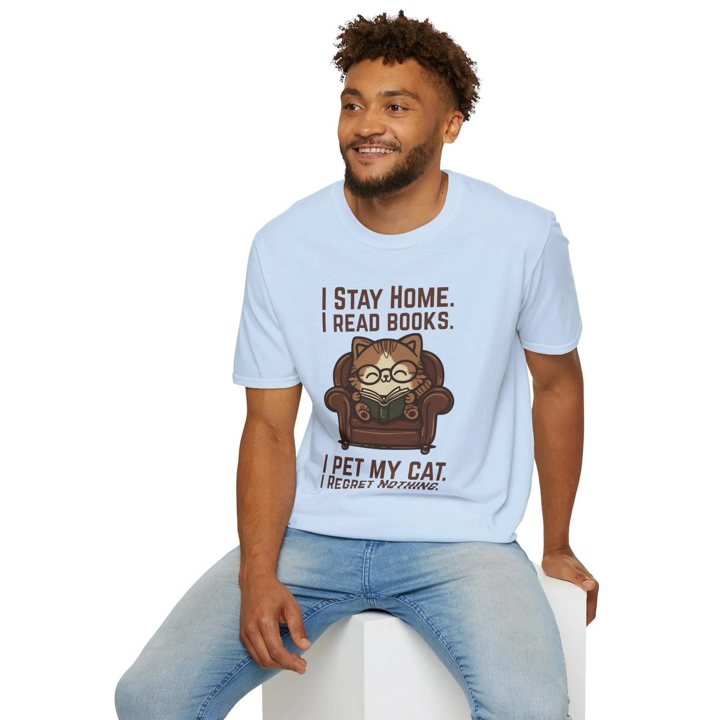 Armchair Cat Reader T-Shirt featuring a cozy cat in glasses, reading a book and humorous text, perfect book lover gift.