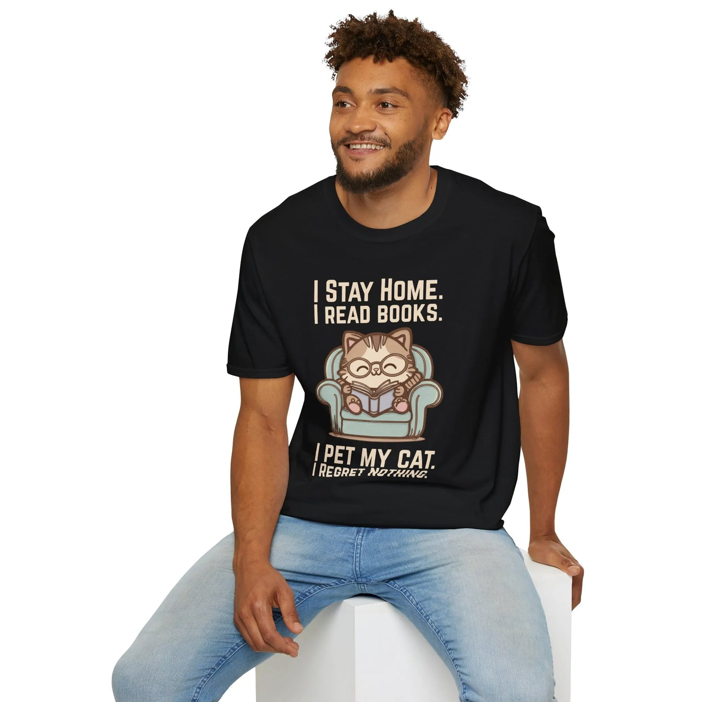 Man wearing a Comfy Cat Reader T-Shirt featuring a cat in glasses saying, 'I Stay Home. I Read Books. I Pet My Cat. I Regret Nothing.' Perfect gift for book lovers.