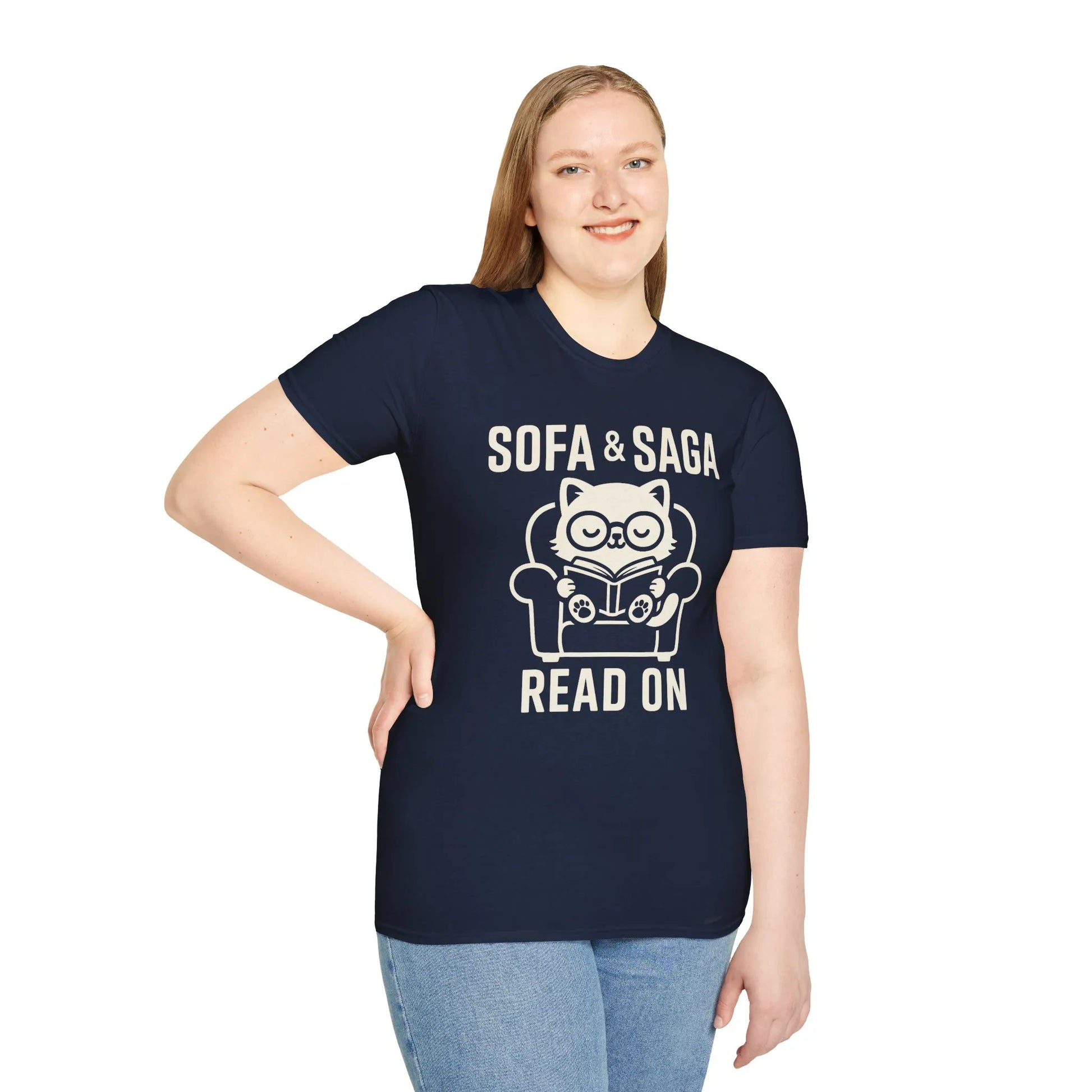 Woman wearing "Sofa & Saga" tee with a cozy cat reading, perfect for book lovers and a witty gift for readers.