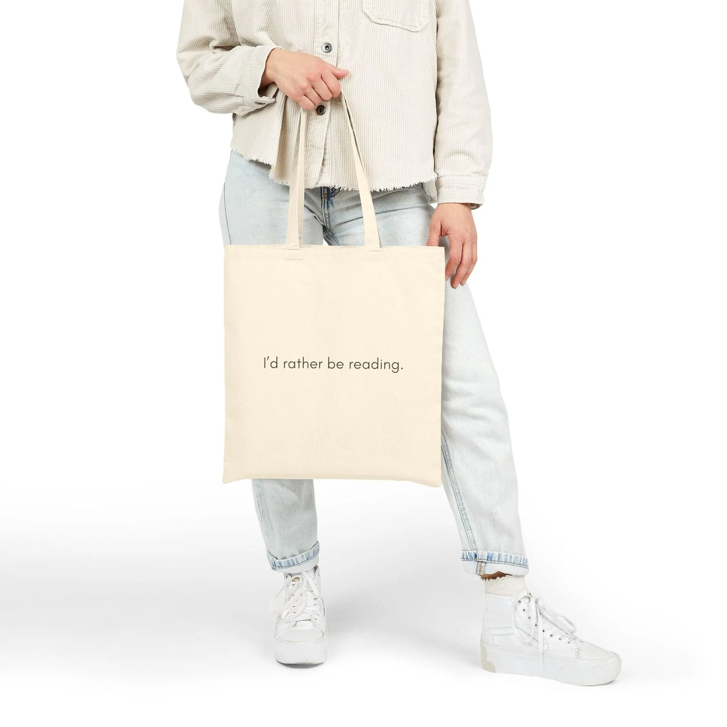 Minimalist Rather Be Reading Tote Bag held by a person, perfect for book lovers who prefer cozy reading moments.