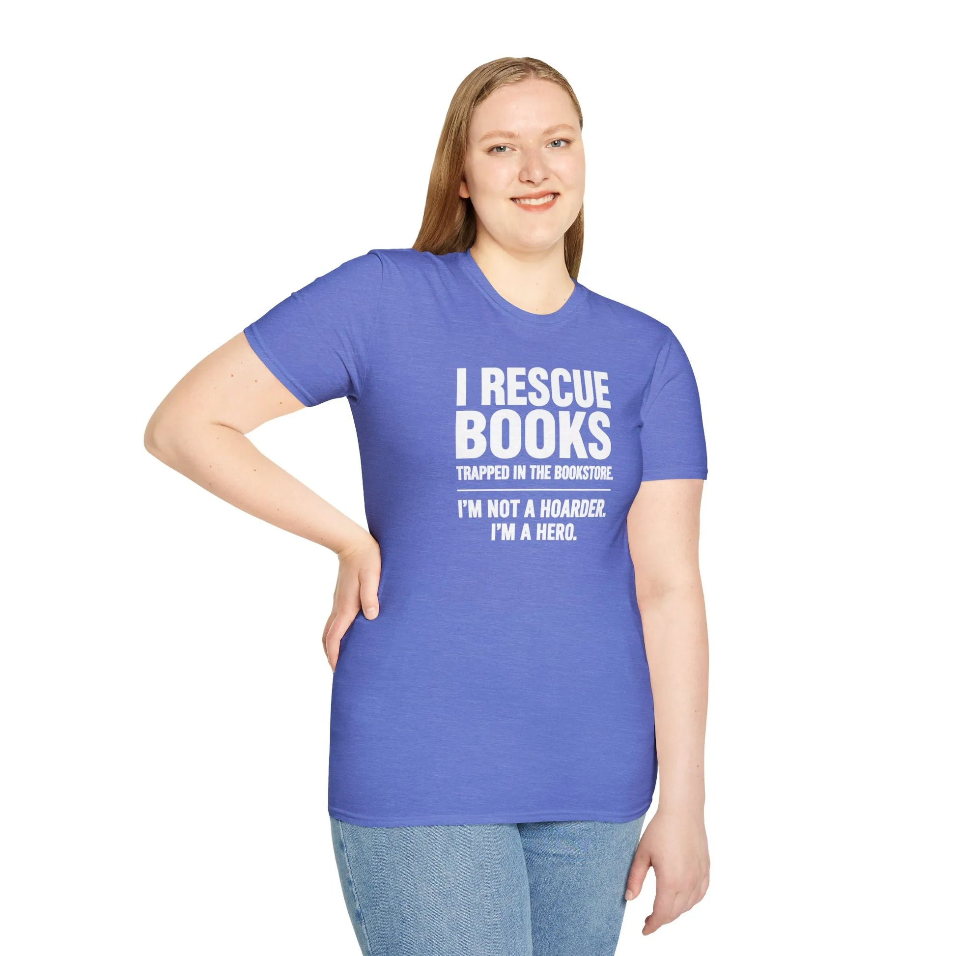 Smiling book lover in a cozy environment, wearing a relaxed fit 'Not a Hoarder T-Shirt', surrounded by books, embodying a reading lifestyle.