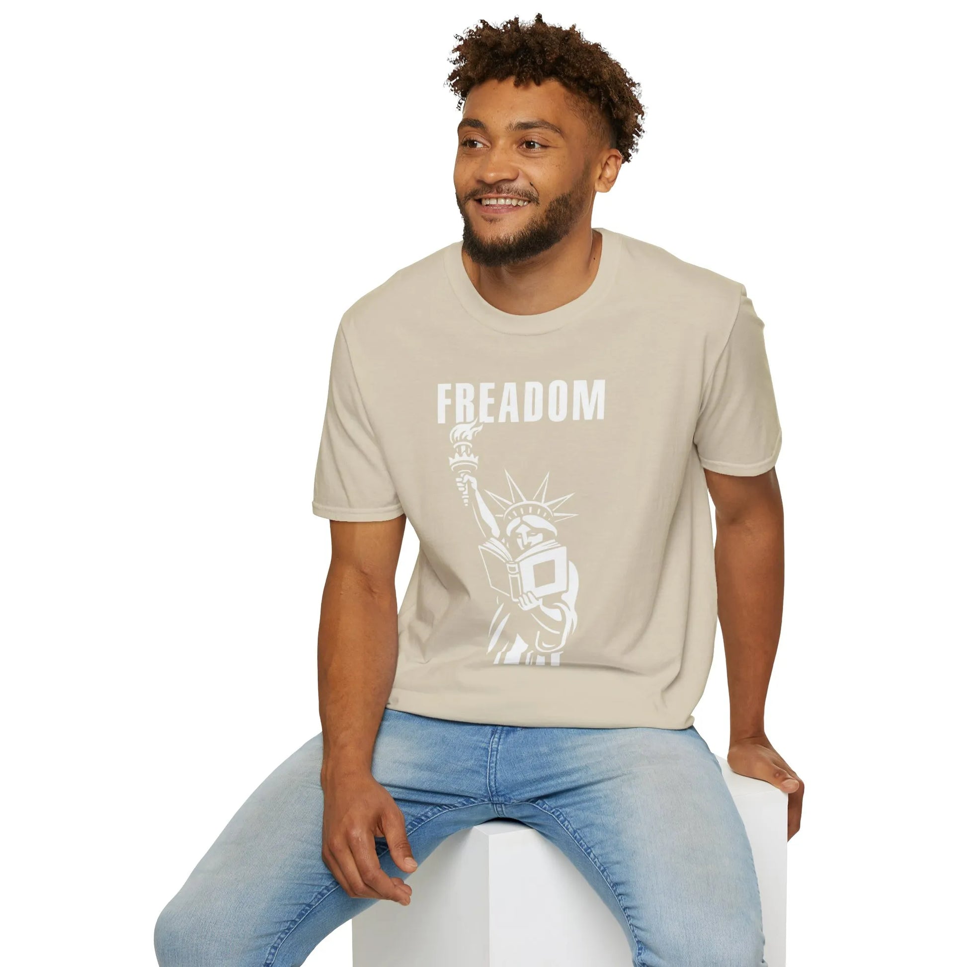 Freadom Statue T-Shirt for book lovers features Liberty Statue holding a book with 'FREADOM' text, cozy fit, unisex gift for readers.