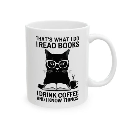 Coffee & Cat Wisdom Mug with a reading cat in glasses and witty text for book lovers who adore coffee or tea.