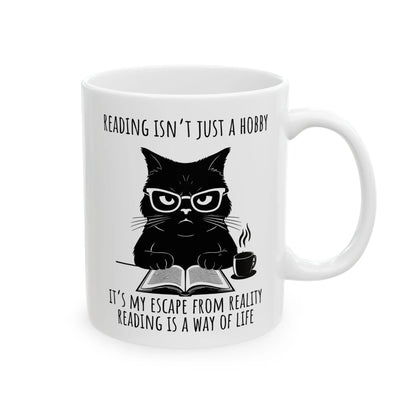 Reading Way of Life Mug featuring a cat with glasses, saying 'Reading isn't just a hobby, it's my escape from reality'.