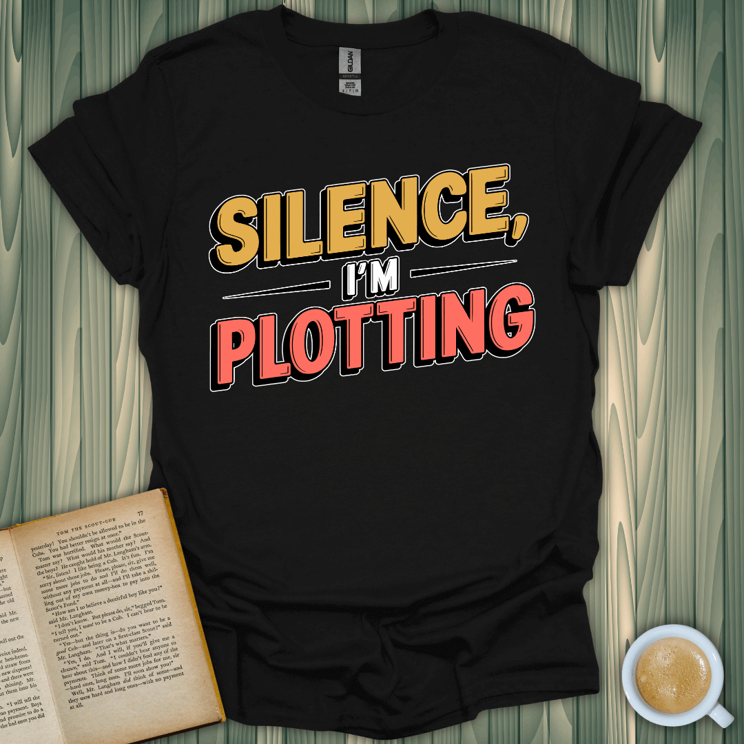 Silence, I'm Plotting T-Shirt for book lovers. Unisex fit, breathable fabric, and premium design perfect for cozy reading sessions!