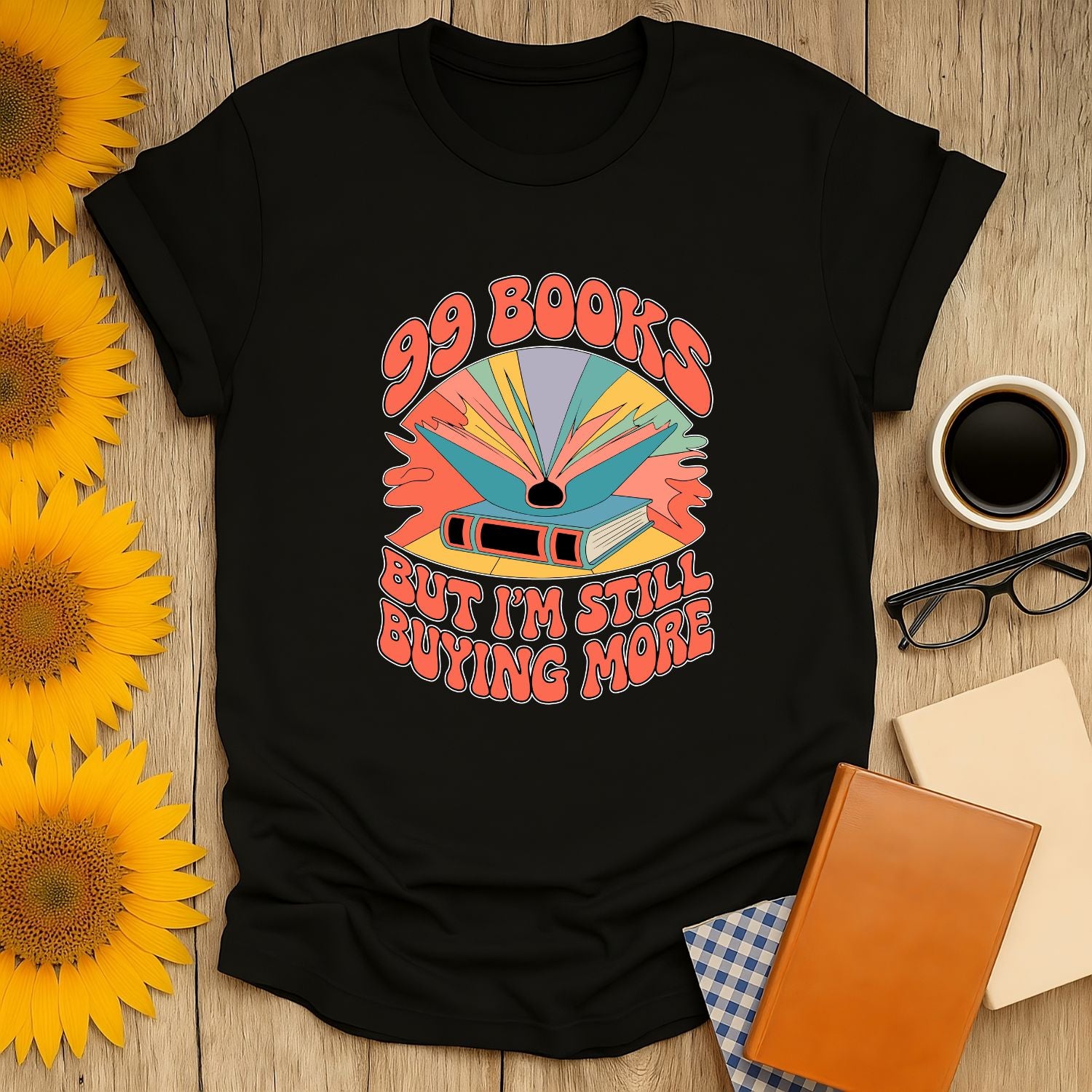 99 Books shirt featuring colorful text and graphic, perfect for book lovers who enjoy cozy reads with coffee or tea.