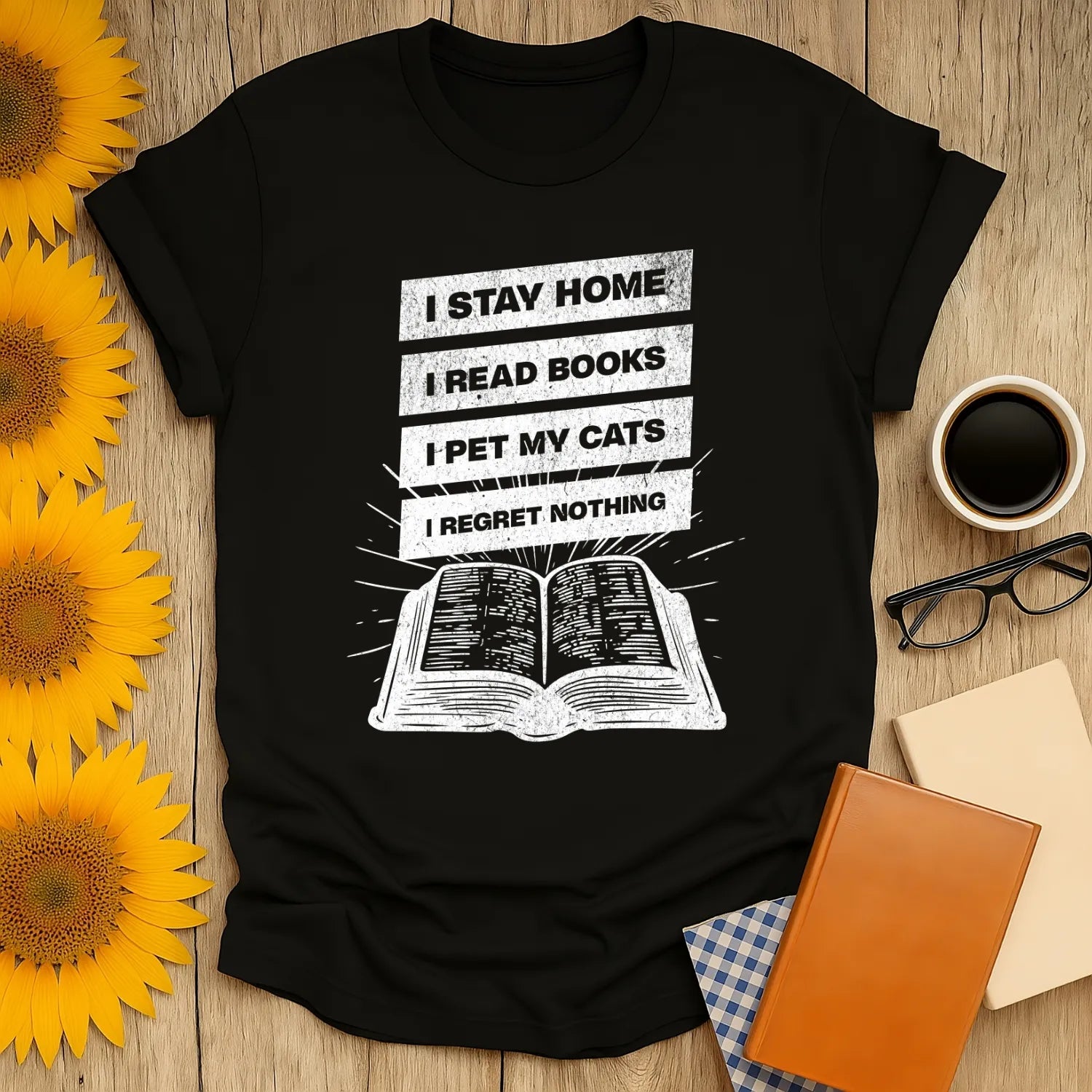 Stay Home Reader T-Shirt featuring a vintage-style text on a cozy black tee: 'I STAY HOME, I READ BOOKS, I PET MY CATS, I REGRET NOTHING.' Perfect for book lovers.