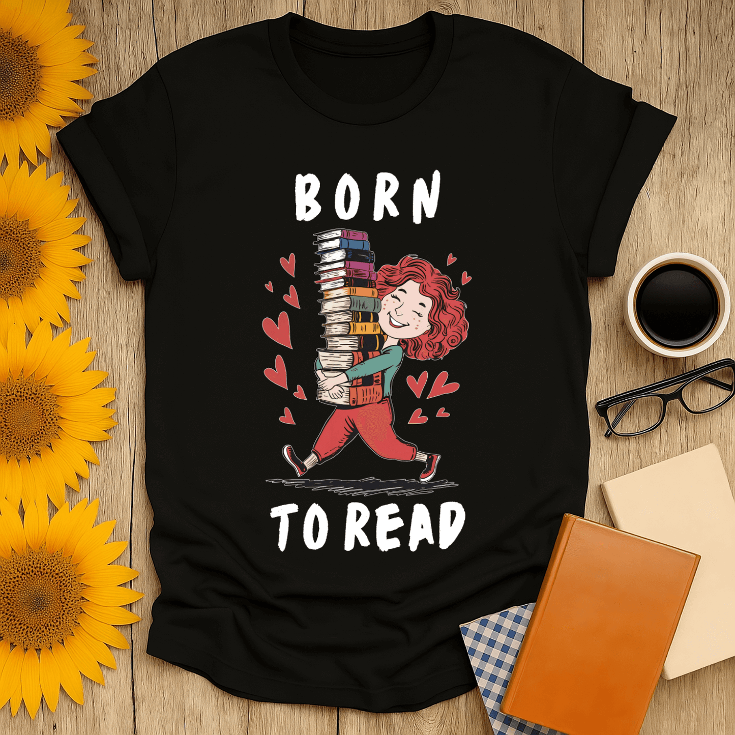 Born to Read t-shirt featuring a joyful reader carrying book stacks, perfect for book lovers.