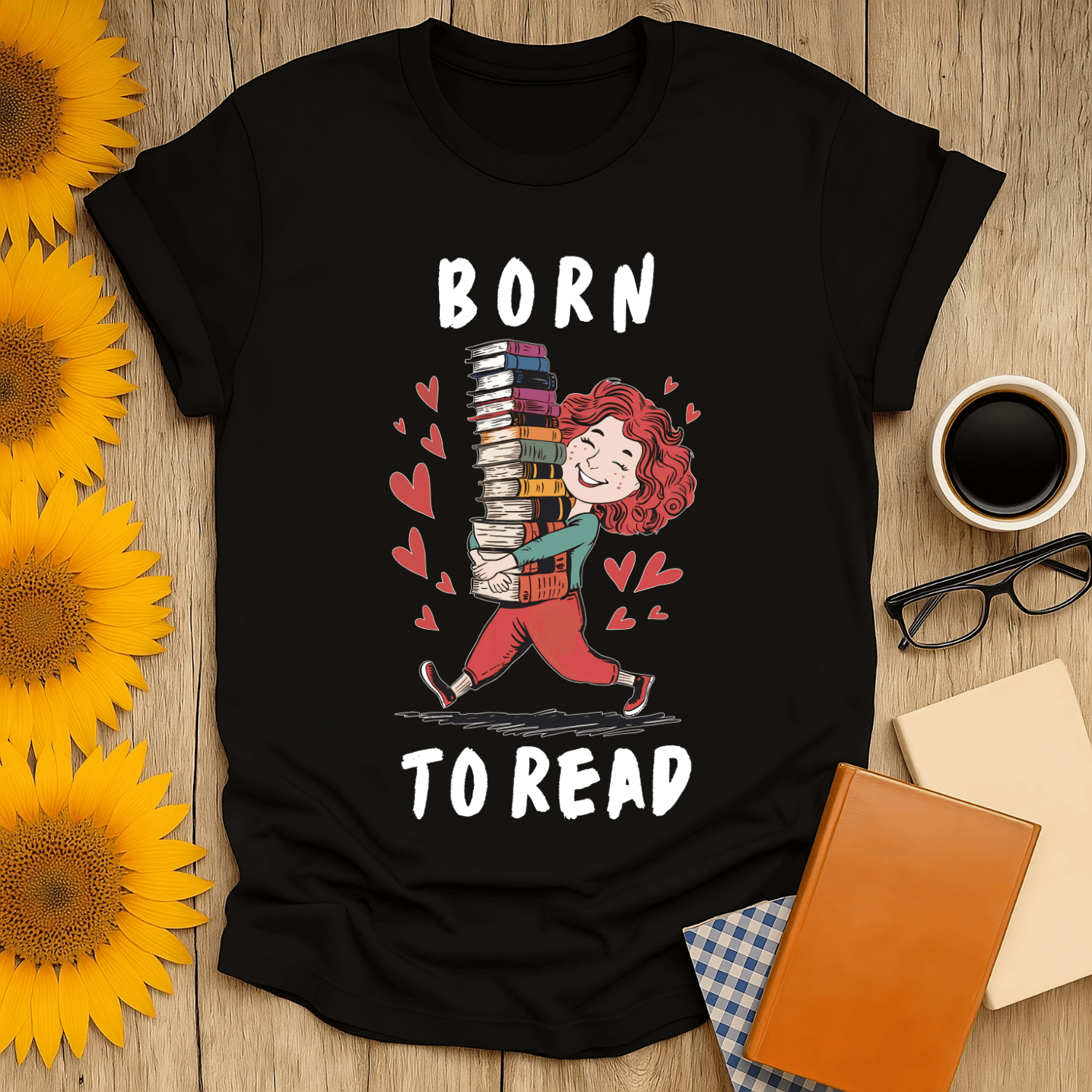 Born to Read t-shirt featuring a joyful reader carrying book stacks, perfect for book lovers.
