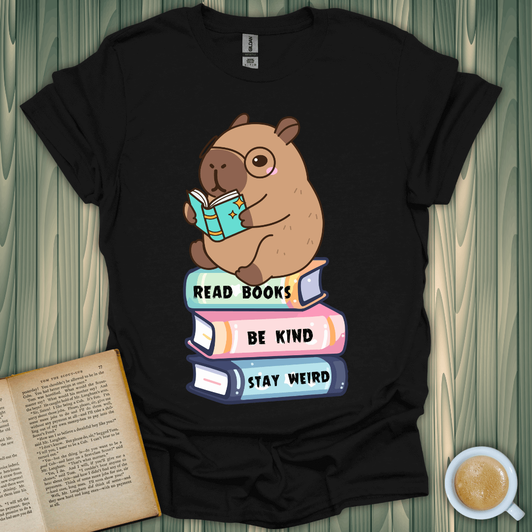 Capybara Reader T-Shirt featuring a cute capybara reading with the words 'Read Books, Be Kind, Stay Weird' for book lovers.