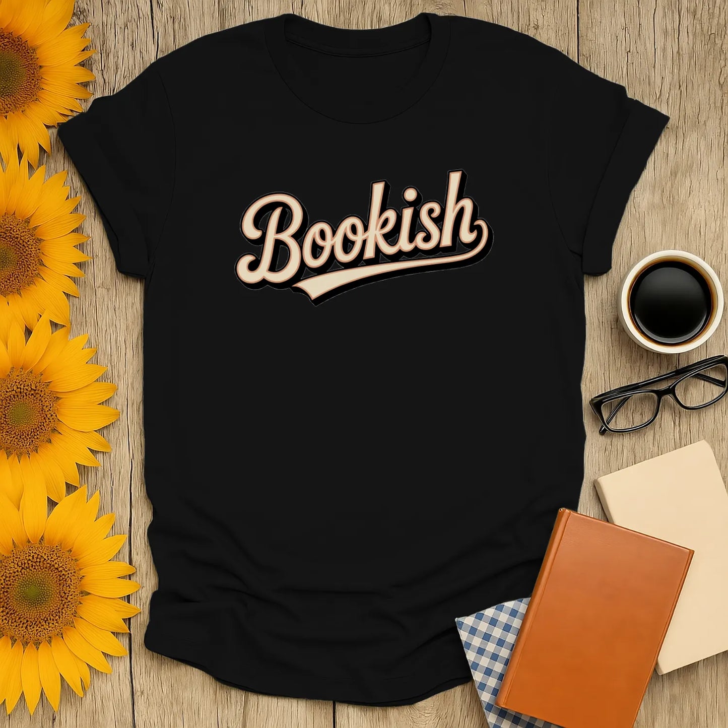 Cozy black t-shirt with 'Bookish' in cursive, ideal for book lovers who adore cats, coffee, and cozy reads.