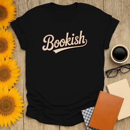 Cozy black t-shirt with 'Bookish' in cursive, ideal for book lovers who adore cats, coffee, and cozy reads.