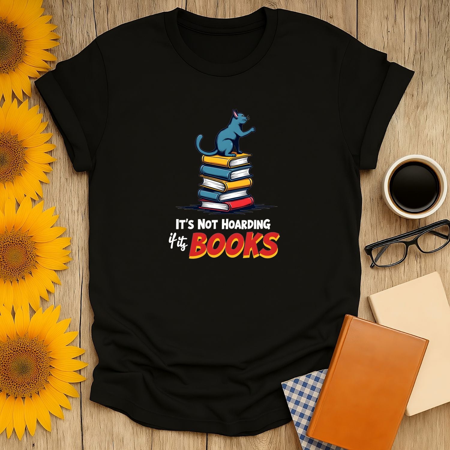 Not Hoarding, Just Books T-Shirt for book lovers featuring a cat and stacked books, 100% ring-spun cotton.