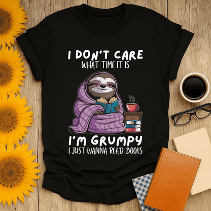 Grumpy sloth book lover t-shirt design featuring a sloth reading, cozy and humorous shirt for book enthusiasts.