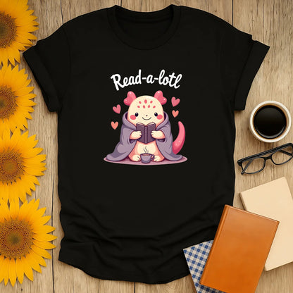 Read-a-lotl T-Shirt featuring a cozy axolotl reading in a blanket, perfect for book lovers and introverts. 📖