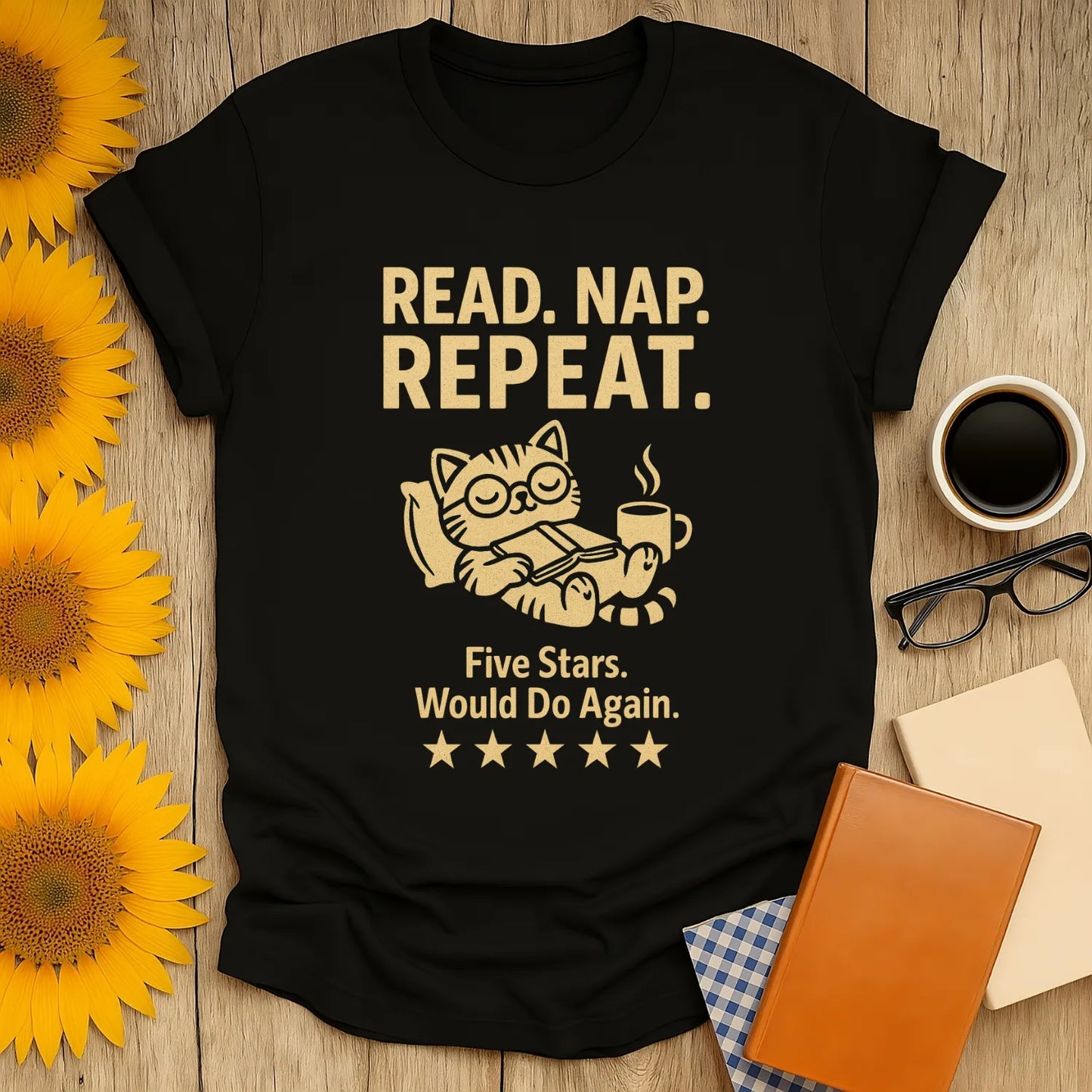 Cozy black t-shirt with a cat reading, coffee cup, text 'Read. Nap. Repeat.' Perfect gift for book lovers who enjoy humor.