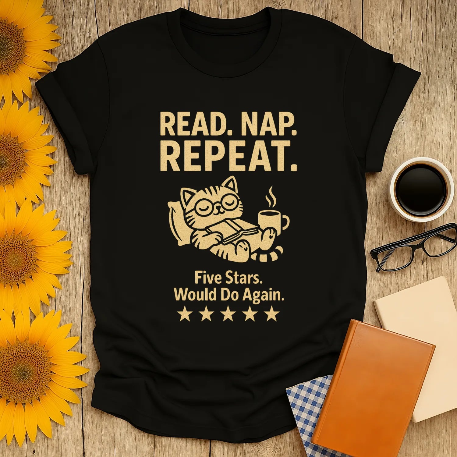 Cozy black t-shirt with a cat reading, coffee cup, text 'Read. Nap. Repeat.' Perfect gift for book lovers who enjoy humor.