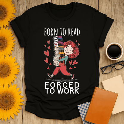 Black t-shirt with 'Born to Read, Forced to Work' design for book lovers, paired with coffee and accessories.