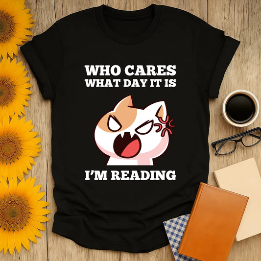 Funny reading tee featuring an angry cat and the text 'Who Cares What Day It Is, I'm Reading'—perfect for book lovers!