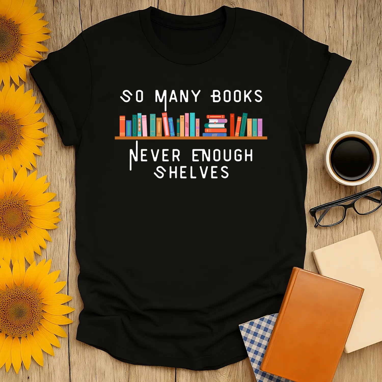 Funny reading tee with shelves of books and text: 'So Many Books, Never Enough Shelves' for cozy book lovers.
