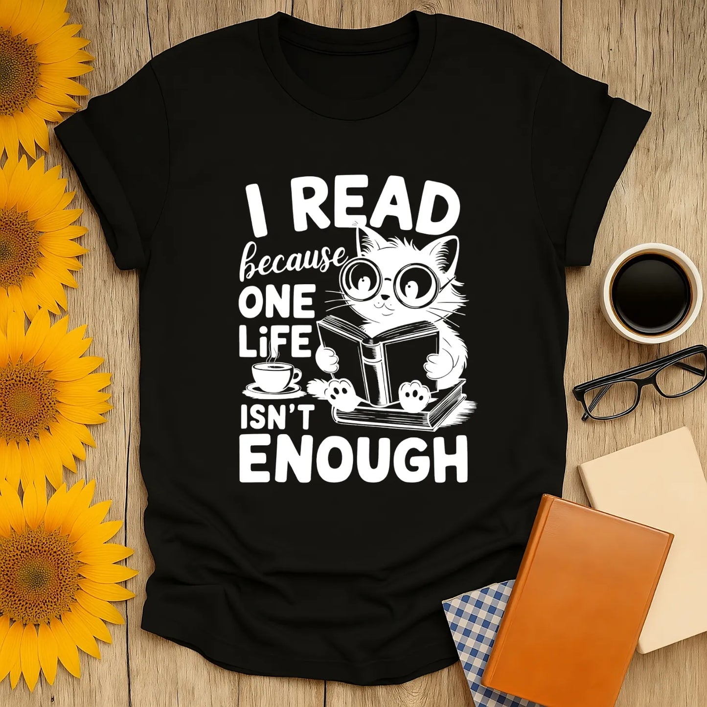 Cozy black tee featuring a cat reading a book with the text 'I READ because ONE LIFE ISN'T ENOUGH'—perfect gift for book lovers!