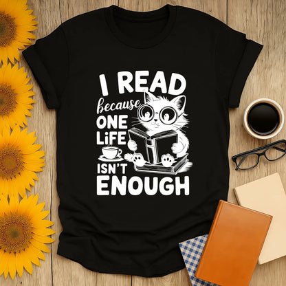 Cozy black tee featuring a cat reading a book with the text 'I READ because ONE LIFE ISN'T ENOUGH'—perfect gift for book lovers!