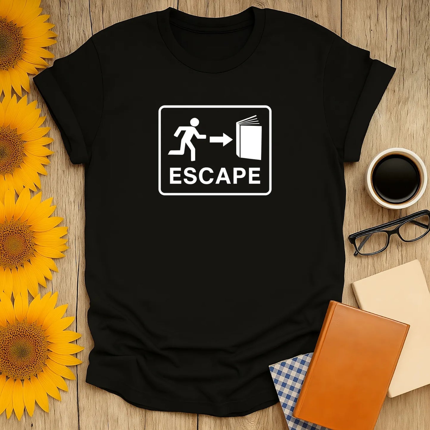Black t-shirt with 'ESCAPE' sign design featuring a person running toward an open book. Perfect gift for cozy book lovers!