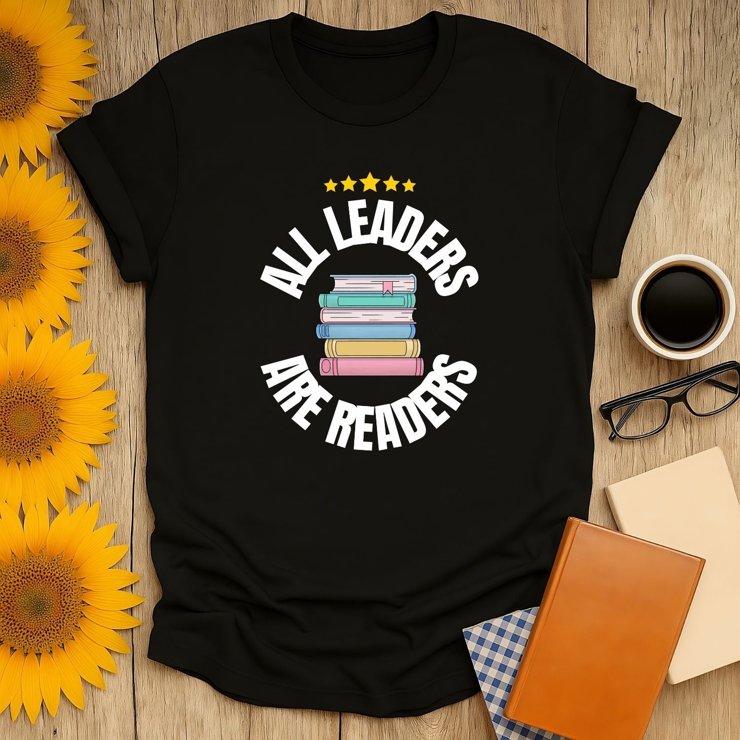 Leaders Are Readers T-Shirt with colorful stacked books and stars, perfect for book lovers who enjoy cats, coffee, or tea.