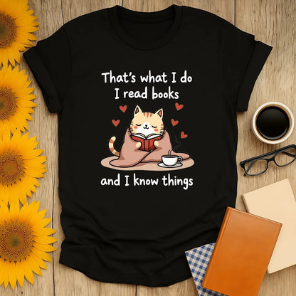 Cozy cat reading a book on a shirt with the text: 'That's what I do I read books and I know things' – perfect for book lovers.