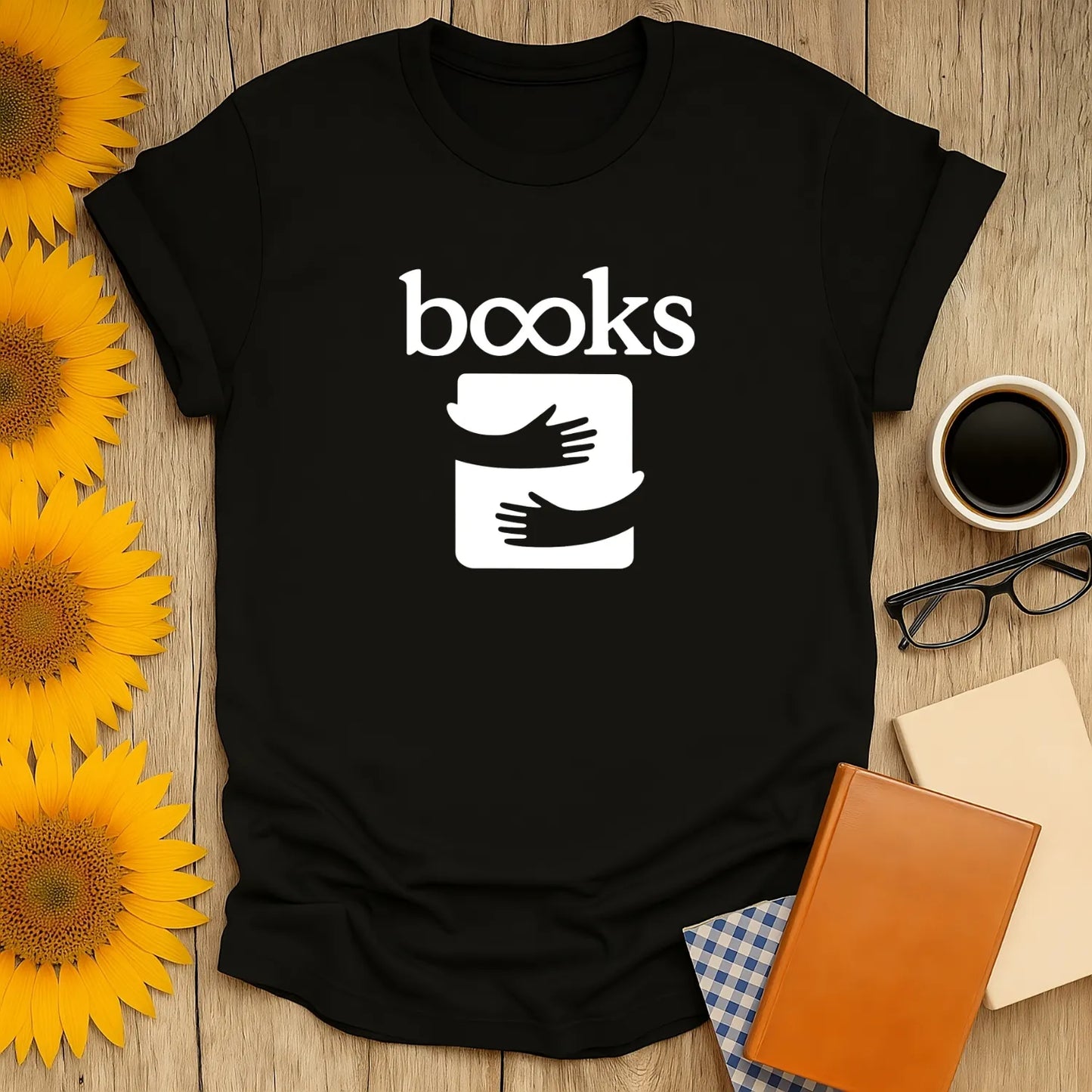 Black book lover shirt featuring 'books' and two hands embracing a book, perfect for cozy reading enthusiasts.