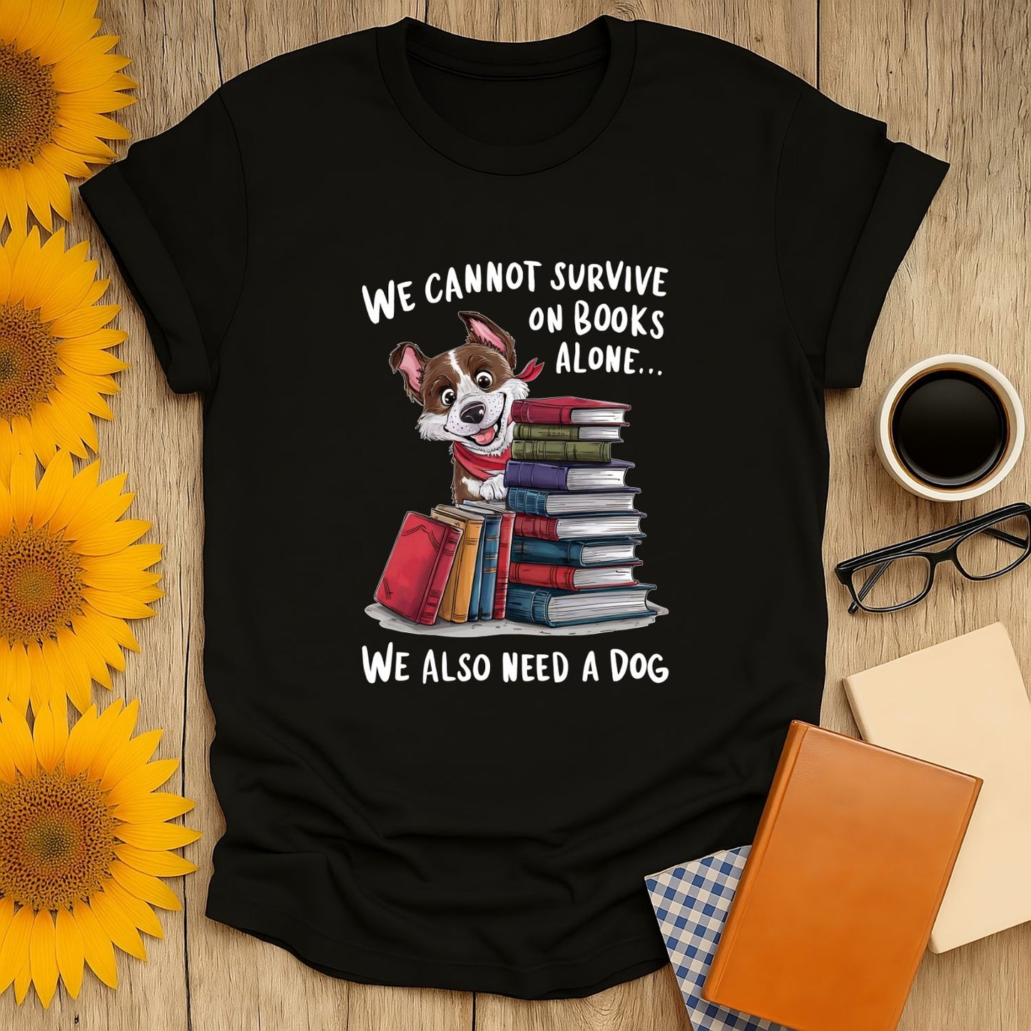 Funny reading tee with a cute dog and books, saying 'We cannot survive on books alone... We also need a dog' for cozy book lovers.
