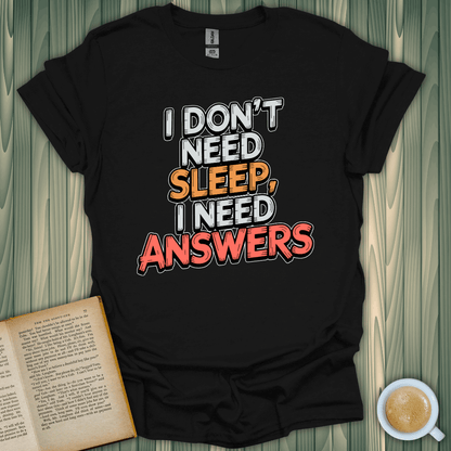 Unisex black t-shirt with playful text: 'I Don't Need Sleep, I Need Answers' for book lovers. 100% cotton.