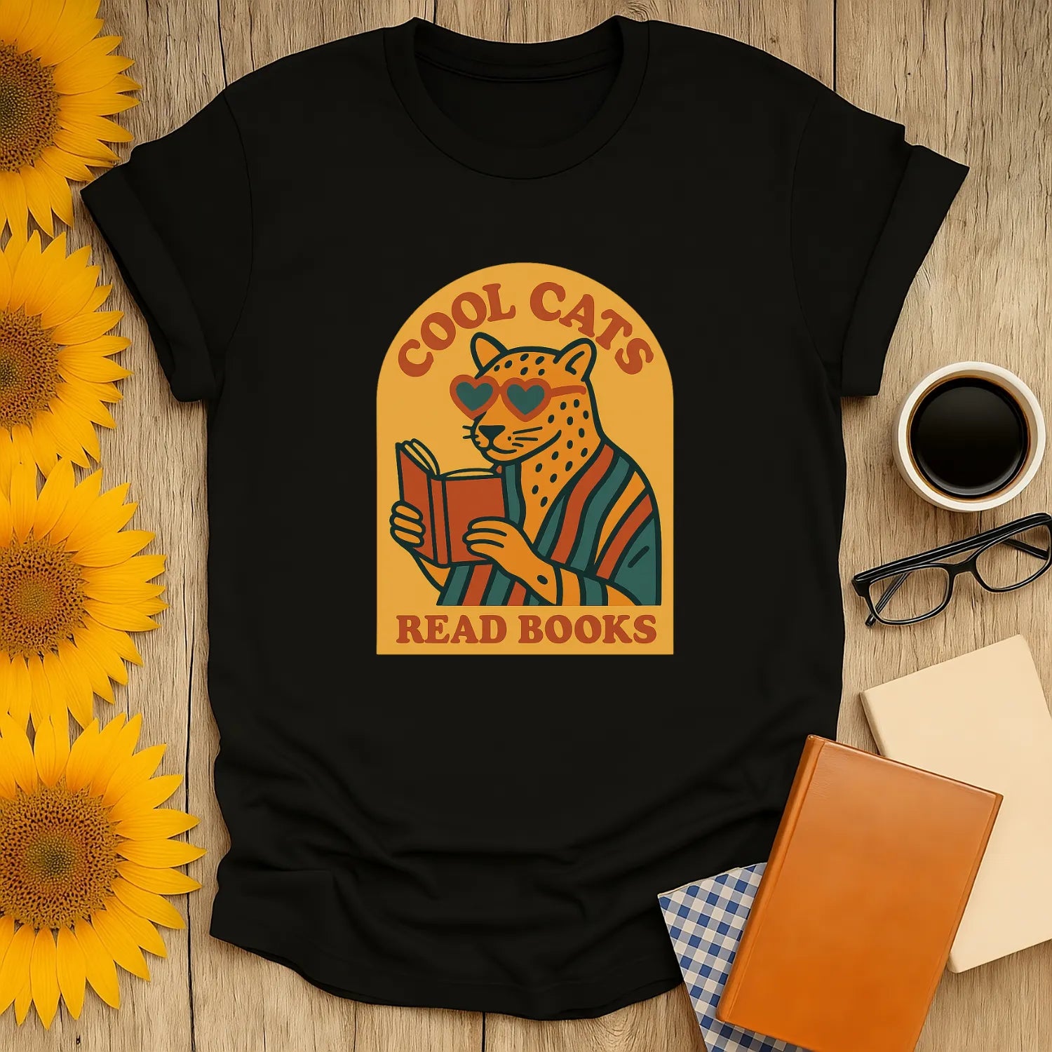 Cool Cats Read T-Shirt features a quirky cat in shades reading a book, perfect for book lovers and coffee fans.