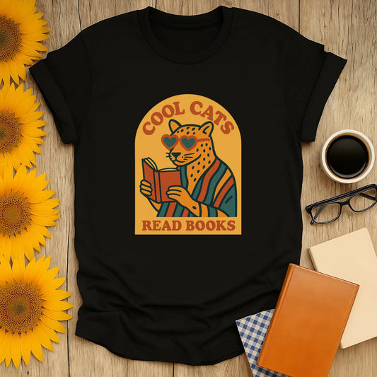 Cool Cats Read T-Shirt features a quirky cat in shades reading a book, perfect for book lovers and coffee fans.