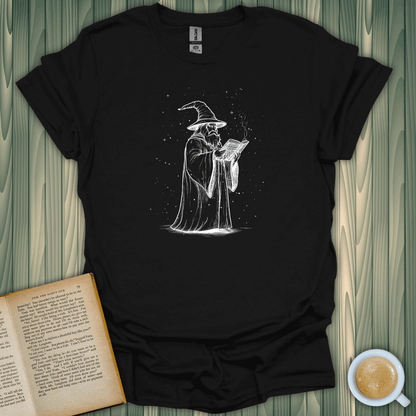 The Wizard's Grimoire T-Shirt for book lovers, featuring a wizard reading a spellbook on a cozy background.