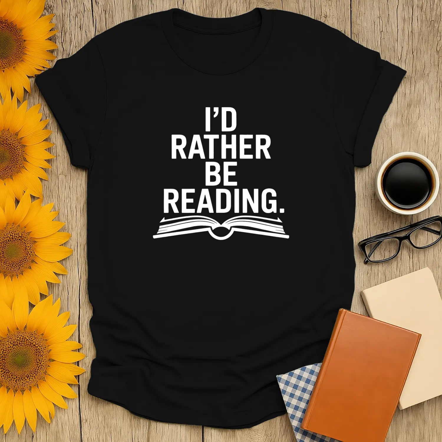 Cozy black tee for book lovers with text 'I'd Rather Be Reading' and an open book illustration, perfect gift for cat and coffee lovers.