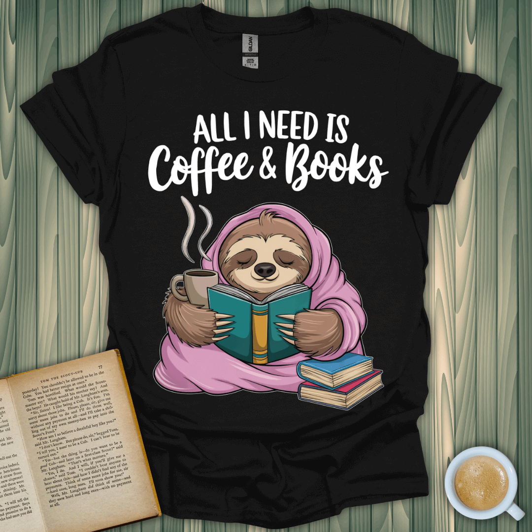 Sloth in a cozy blanket reading with coffee and books on a black t-shirt for book lovers.